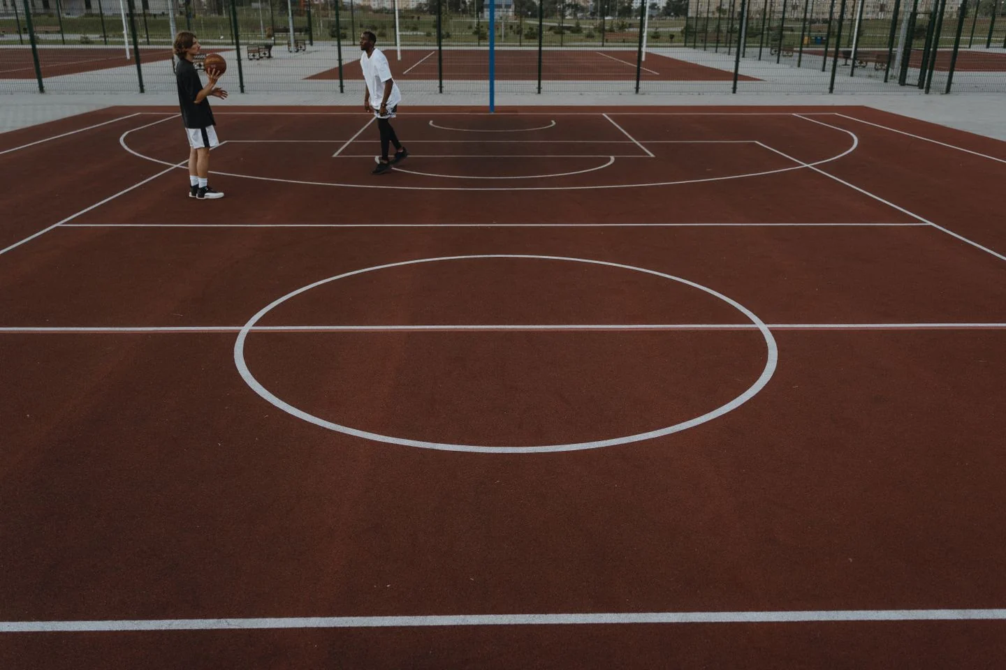 Basketball practice on an outdoor court